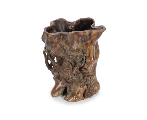 AN ALOESWOOD AND BOXWOOD BRUSHPOT18th centuryCarved irregularly as a hollowed-out trunk with relief decoration to the side of