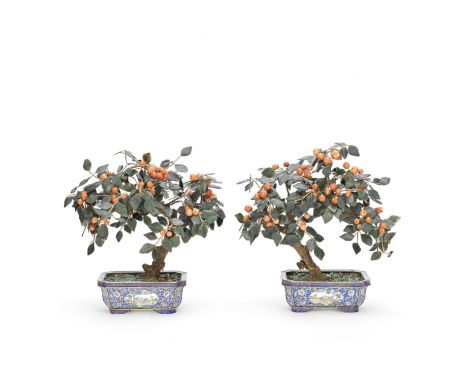 A PAIR OF HARDSTONE MODELS OF ORANGE TREES IN ENAMEL JARDINIERES19th centuryEach formed of mottled spinach green jade leaves 