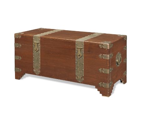 A BRASS-BOUND TEAK RECTANGULAR TRUNK; AND THREE CARVED GILT-LACQUERED PANELSCirca 1900 and 20th centuryThe trunk with hinged 