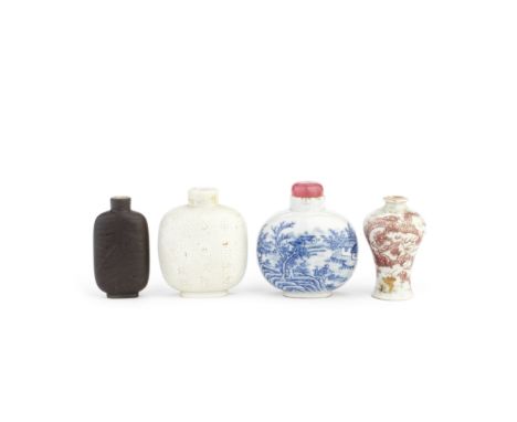 A GROUP OF FOUR PORCELAIN AND YIXING SNUFF BOTTLES19th/early 20th centuryComprising: a blue and white river landscape snuff b