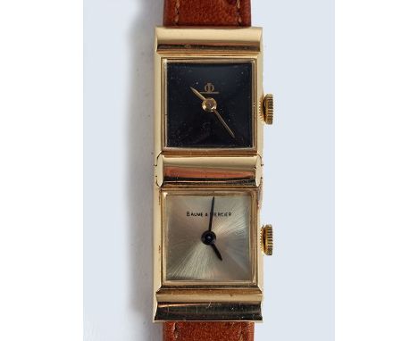 A Baume and Mercier, 1970s, dual time-zone, lady's wrist watch, the 14k gold, double case 15mm wide, 14mm deep, hinged in the