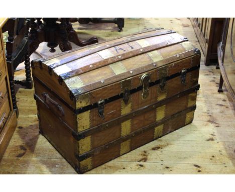 Dome topped brass and wood bound cabin trunk