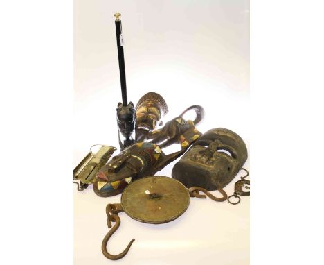 Polished brass thermometer, three balance scales and four tribal carvings