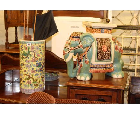 Pottery elephant stool, Oriental pottery stick stand, two brollies and parasols