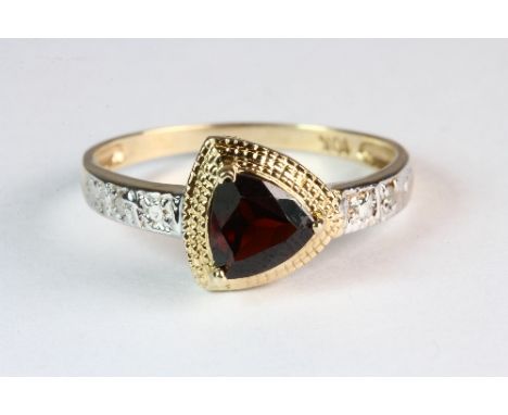 A 9ct gold garnet and diamond ring (O)