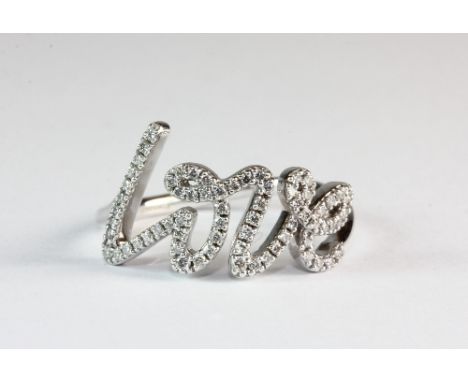 An 18ct white gold diamond set Tiffany love ring (N.5)