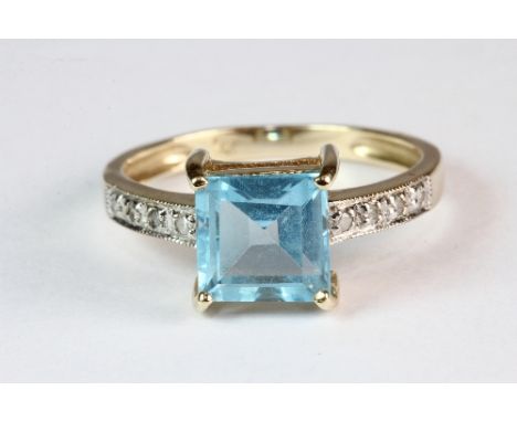 A 9ct gold blue topaz and diamond ring (M.5)
