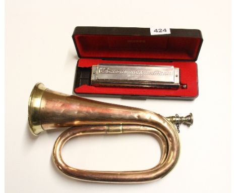 A Hohner 4 octave harmonica and a bugle