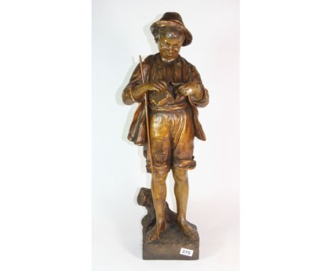 A large Goldscheider pottery figure of a boy with a fish H 74cm (A/F)