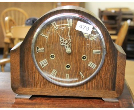 A chiming oak mantle clock