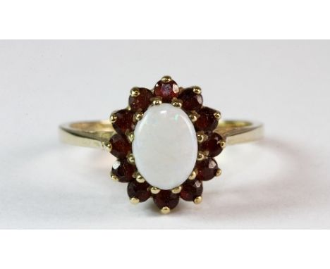 A 9ct gold opal and garnet cluster ring (L)