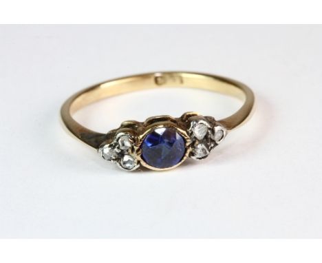 An 18ct gold diamond and sapphire ring (M.5)