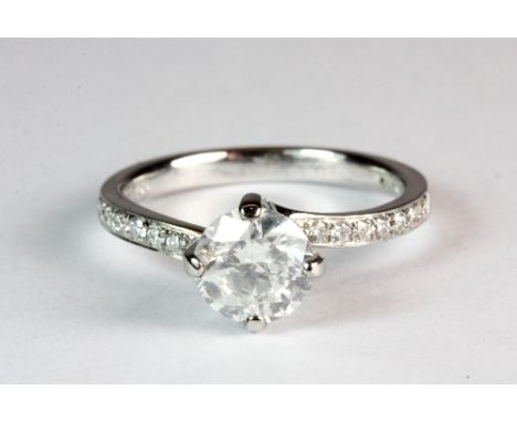 An 18ct white gold ring set with a centre diamond approx. 1.05ct and a further 0.2ct in the shoulders (L) Est. £1,200 - 1,400
