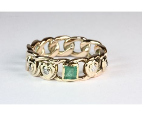 A 9ct gold diamond and emerald set curb chain style ring (P)