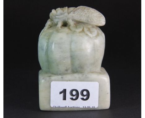 A mid 20th century Chinese green soapstone seal mounted with a cicada on a melon H 8.5cm