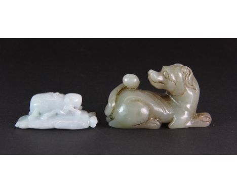 A carved celadon jade figure of a dog (6.5cm x 4cm) together with a nephrite jade amulet of an insect on a leaf
