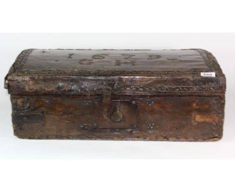 An early skin covered pine traveling trunk dated 1679 in stud work. 61cm x 34cm x 23cm