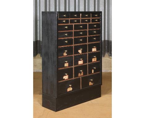 A set of industrial workshop drawers,first half of the 20th century and later, with an ebonised finish,73cm wide25cm deep110c