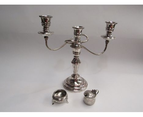 A silver salt on tripod feet (no liner), a silver mustard pot with blue liner, no spoon, plated candlestick, 94g silver weigh