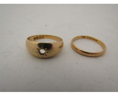 A 22ct gold wedding band and 18ct signet ring, diamond missing 