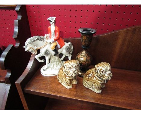 A pair of ceramic Bulldog figures, a dandy on horse back and a laquered Indian candlestick (4) 
