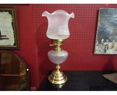 A brass electric lamp in the form of an oil lamp 