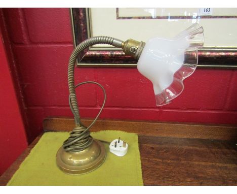 An early 20th Century adjustable table lamp, brass ringed column and base with opaque white wavy edge shade 