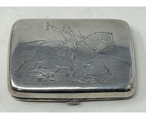 A Victorian silver cigarette case, crested, the front engraved with hunting scene , London 1866 