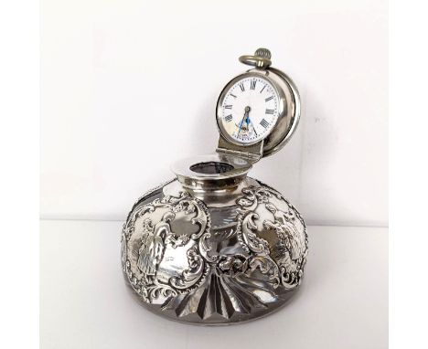 An Edward VII novelty glass and silver mounted inkwell, the hinged lid to reveal a clock, London 1903 
