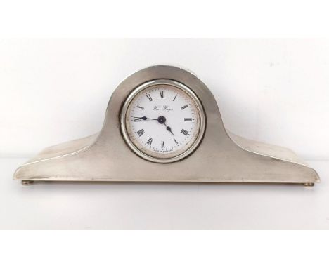 A modern silver cased mantel clock, 17 cm wide 