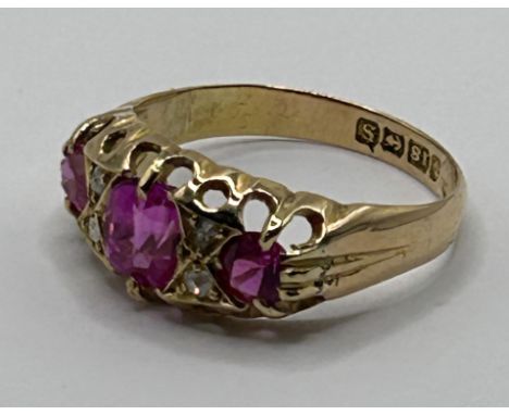 An 18ct gold, diamond and pink saphire ring 