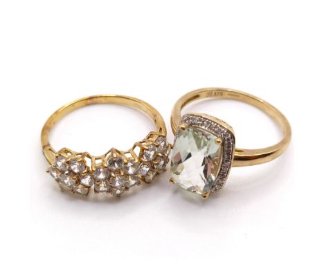 A 9ct gold, blue and white stone ring, ring size S, and a 9ct gold and white stone ring, ring size T (2) 