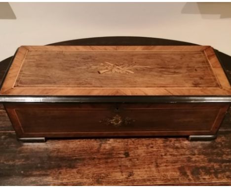A 19thC Swiss cylinder musical box retailed by List Thellung &amp; Staffauch of Zurich, playing 12 airs on a 9.5" cylinder, i