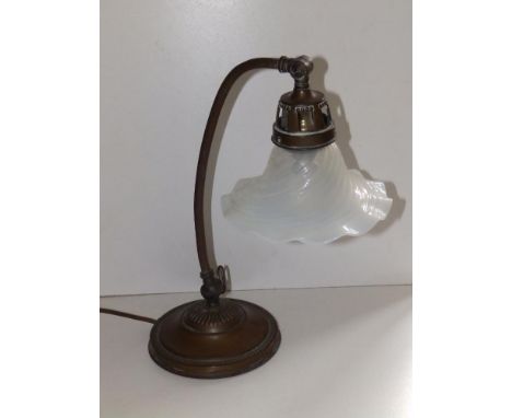 An early 20thC brass angle poise lamp with fluted vaseline glass shade, 14.5" high and a pair of spiral twist brass candlesti