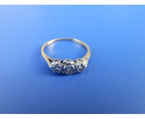 A small three stone diamond ring. Finger size L.