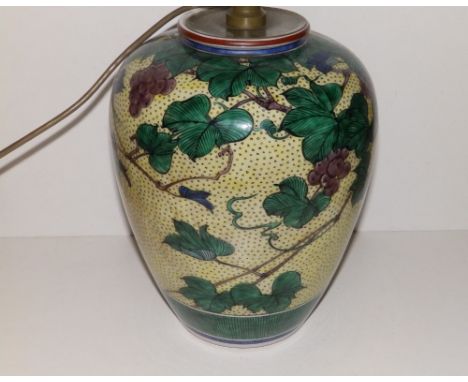 A Japanese porcelain vase, in use as a lamp, decorated grape vine foliage, green painted seal mark to underside, 11.5" high.