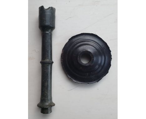 A medieval bronze candlestick stem and a base, stem 5", diameter 2.75" diameter.  Excavated from separate sites.