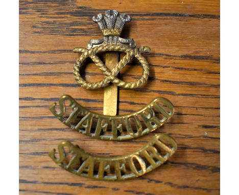Staffordshire Regiment (Prince of Wales's) Cap Badge and pair of Shoulder Titles. K&amp;K: 2050 worn 1959 onward.