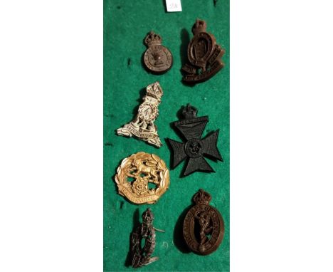 British WWII (Economy Plastic) Cap Badges (7) including: Army Catering Corps, Royal Army Ordnance Corps, Labour Corps, King's