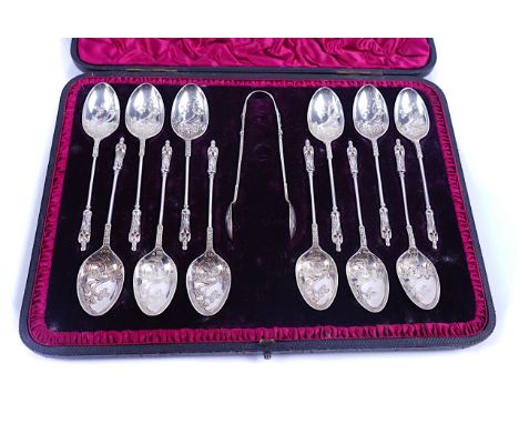 A LATE VICTORIAN SET OF TWELVE SILVER TEASPOONS WITH MATCHING SUGAR TONGSEach with a figure terminal to the handle and with a