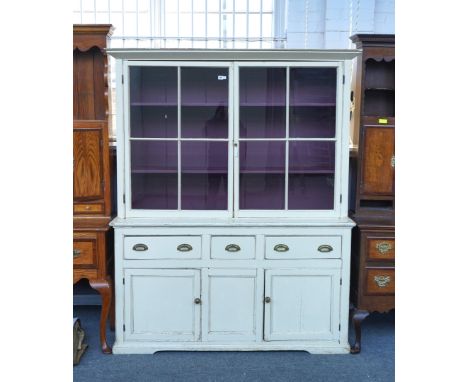 A CREAM PAINTED PINE DRESSER CABINETWith pair of glazed doors over there drawers and cupboards, 161cm wide; 48.5cm deep; 194c