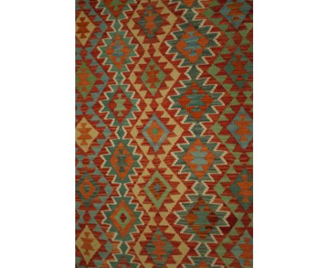 AN ANATOLIAN DESIGN KILIM CARPETThe polychrome field with interconnecting diamond motifs, with a black border of minor madder