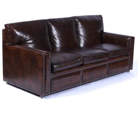 TAN LEATHER UPHOLSTERED THREE SEAT SOFAWith copper studded decoration, 202cm wide; 90cm high