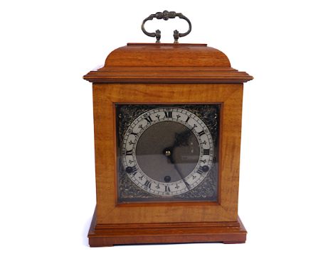 AN ENGLISH WALNUT CASED EIGHT-DAY MANTEL CLOCK BY PERIVALE20th CenturyThe 6 inch square dial with Roman numerals and engraved