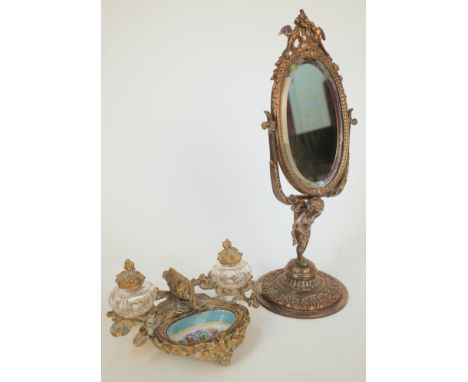A FRENCH SILVER-PLATED TOILET MIRROR AND A GILT-METAL MOUNTED SEVRES STYLE CERAMIC INKSTAND (2)Late 19th / Early 20th Century