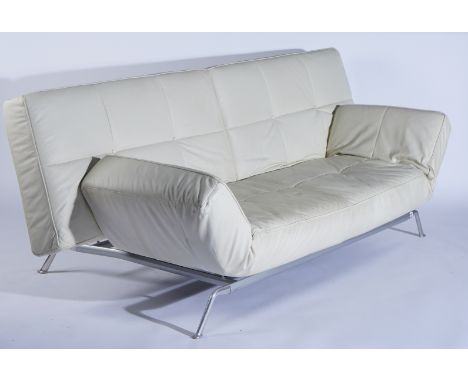 LINGE ROSET; A MODERN CREAM LEATHER SOFAOn polished steel base, 230cm wide; 90cm high