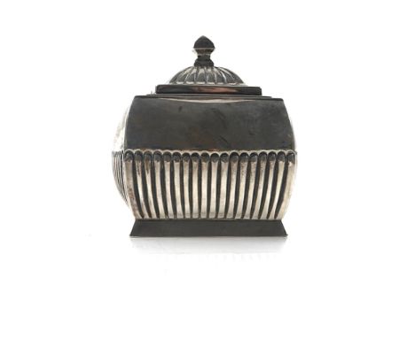 A LATE VICTORIAN SILVER HINGE LIDDED TEA CADDYOf square bombe form, with partly fluted decoration to the body and to the hing