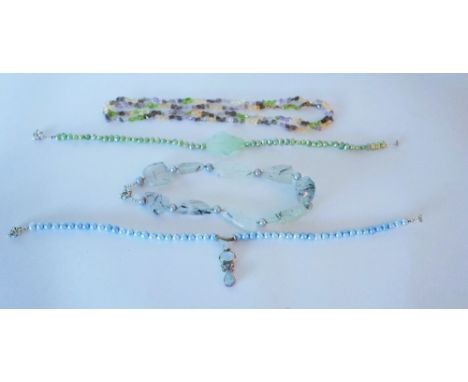 FOUR NECKLACES (4)Comprising; a labradorite and cultured pearl necklace, a varicoloured hardstone bead necklace, a blue tinte