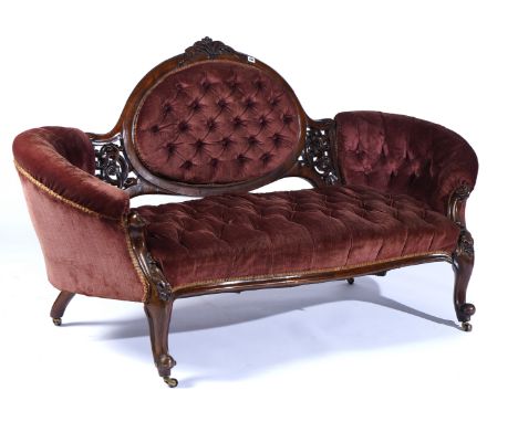 A VICTORIAN ROSEWOOD FRAMED TUB BACK SOFAWith serpentine seat on scroll supports, 185cm wide; 100cm high