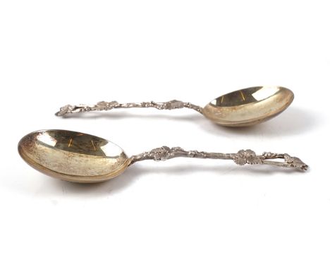 A PAIR OF SILVER SERVING SPOONS (2)The handles of foliate and rustic design, Sheffield 1902, length 18cms, weight 80 gms, wit